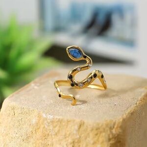 Serpenti Elegant Gold Snake Ring with Blue Accents